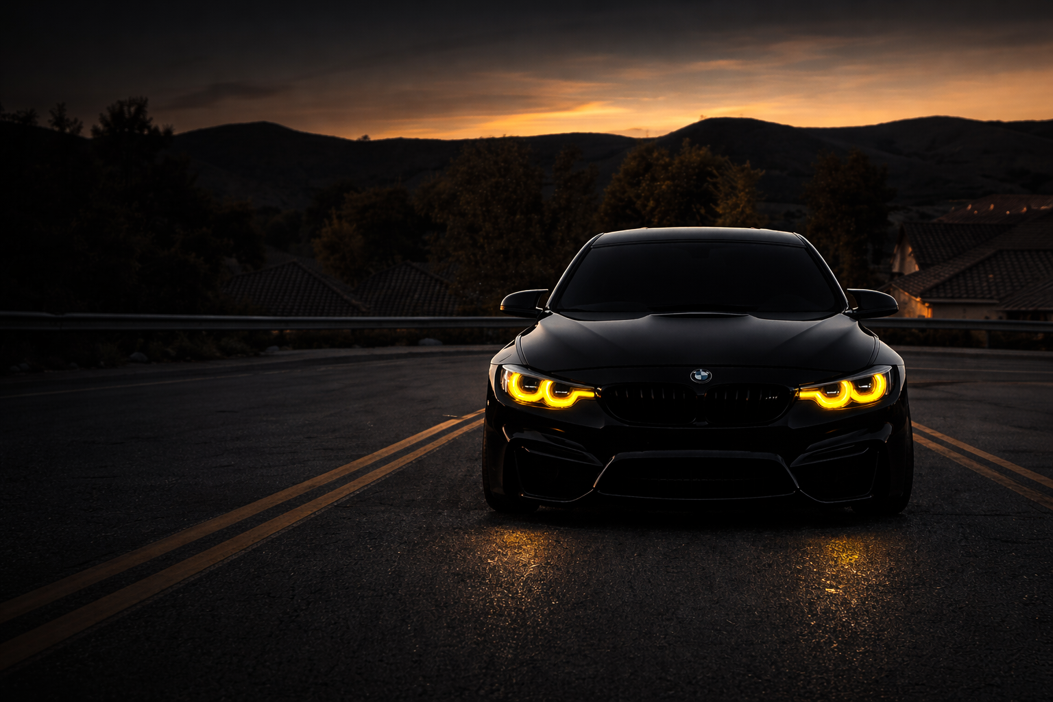 BMW M with glowing quad headlights on a dark road at dusk